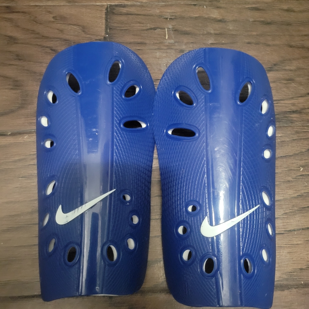 Nike Royal Blue Shin Guards with White Swoosh. Youth